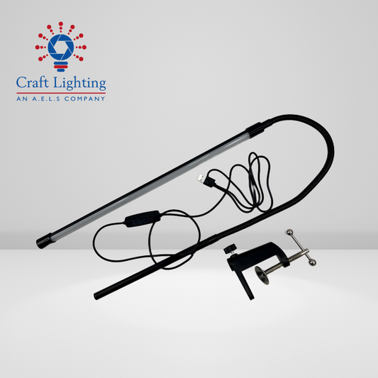 An image of a gooseneck LED light with a cord, captured in black and white, offering versatile lighting options